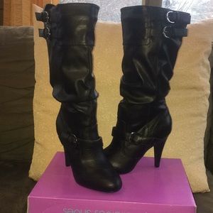 High heeled black boots